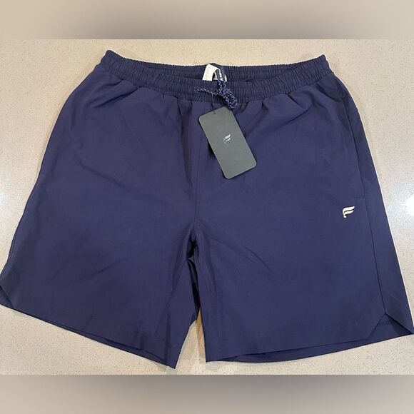 NEW WITH TAG! Men's Fabletics Navy Blue 7" Swim Trunk Size Large - Picture 1 of 6